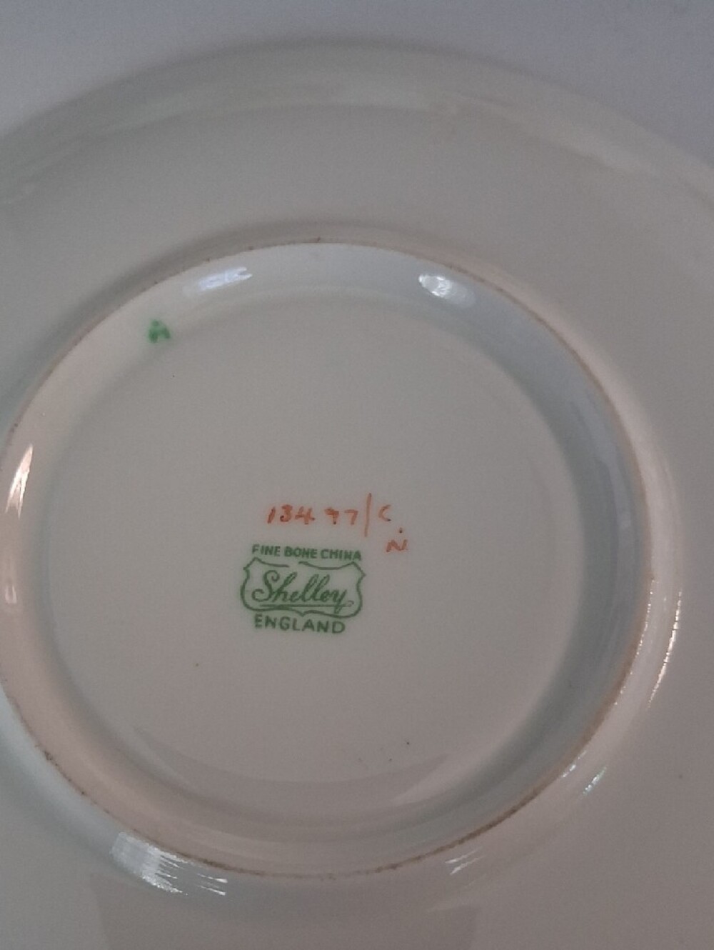 White Teacup and Saucer with Green Polka Dots and Gold Trim - Picture 3 of 4